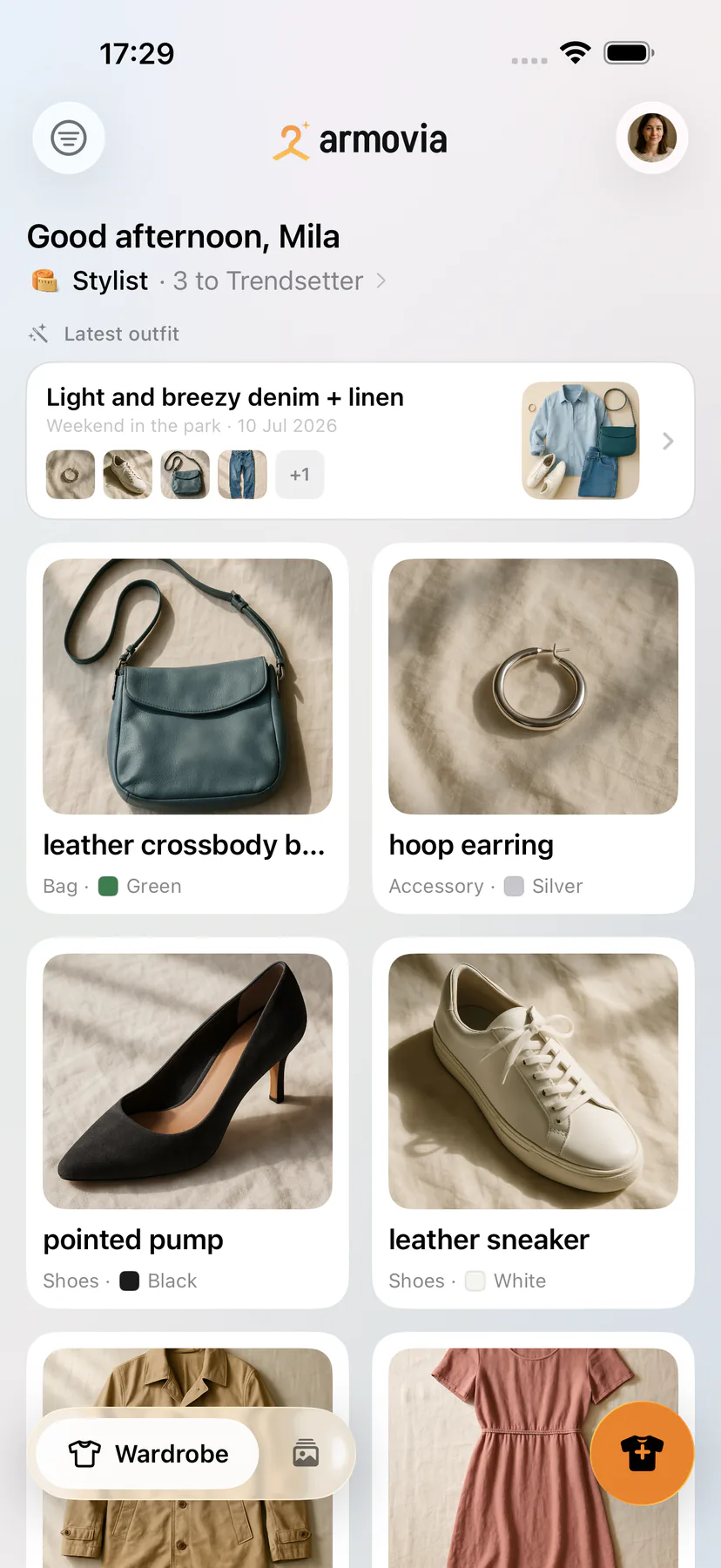 The Armovia home screen on iPhone: a personal greeting, wardrobe level, and a grid of freshly tagged clothes.